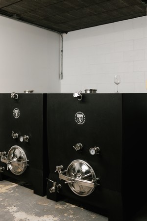 Two black beer tanks are placed side by side at Good Harbor Vineyards in Lake Leelanau, MI